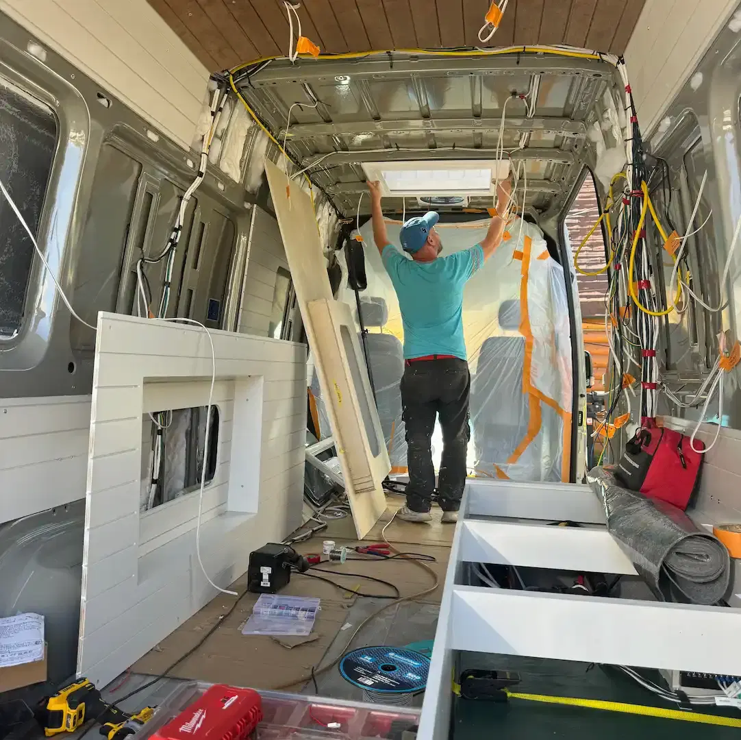 A camper van being built in a workshop