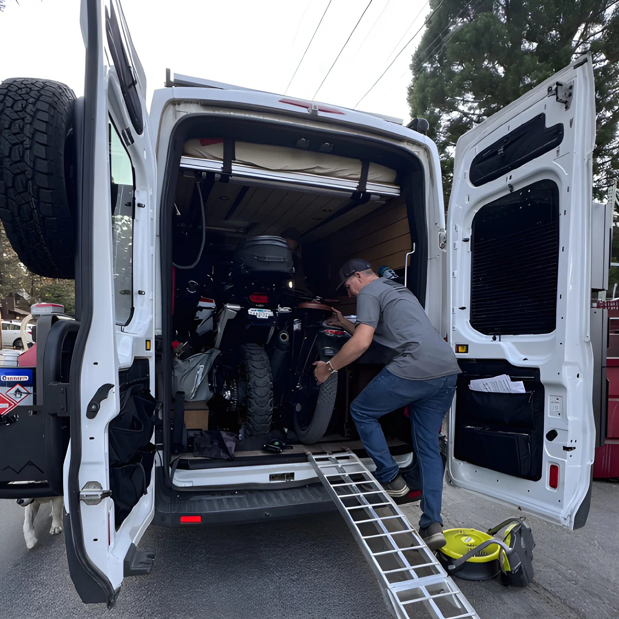 Big Bear Vans moto van with motorcycles loaded in the rear garage