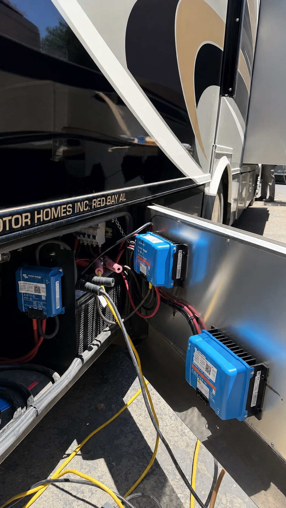 Clean Class A motorhome service bay with upgraded electrical equipment